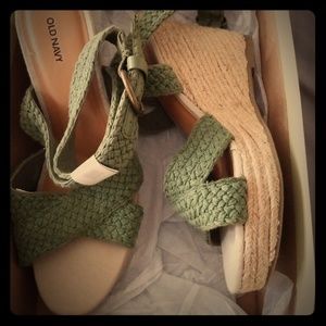 Sage green woven wedge sandal.